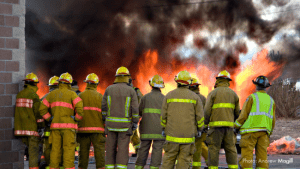 Decimation of Public Sector Employees - Firefighters at a fire / Photo: Andrew Magill