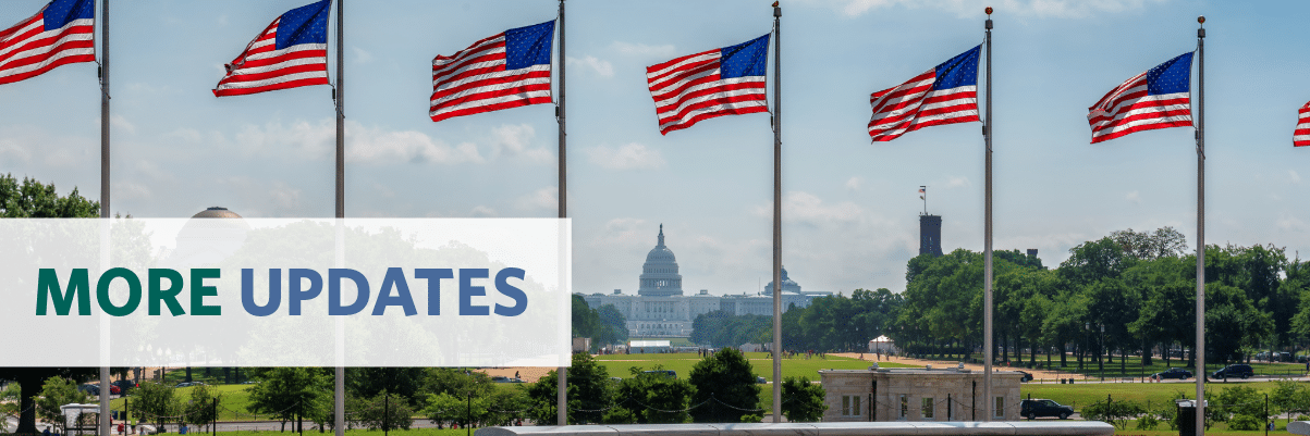 Photo of a clipboard with text "Inflation Reduction Act" on an American flag