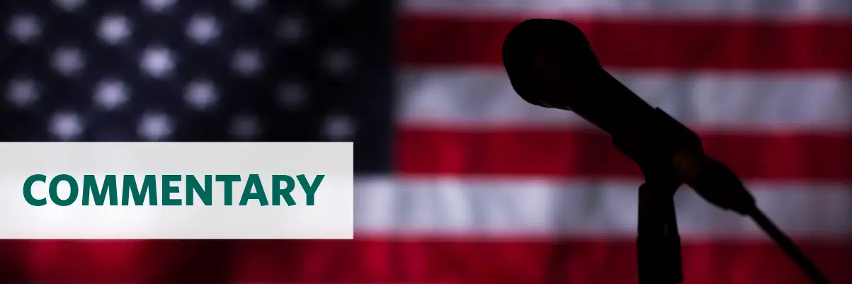 Photo of a clipboard with text "Inflation Reduction Act" on an American flag