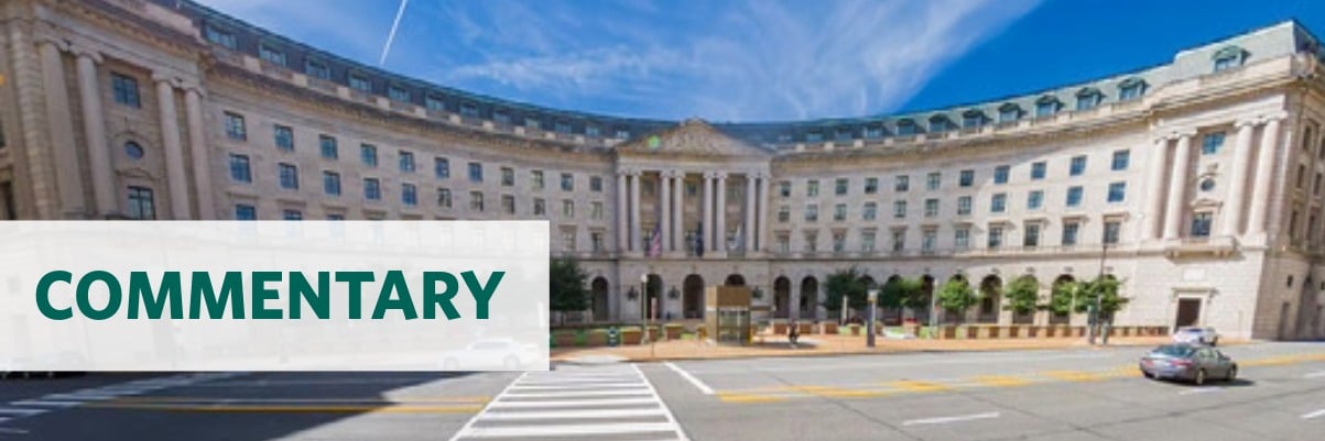 Photo of the Department of the Interior headquarters building with the text overlay "commentary"